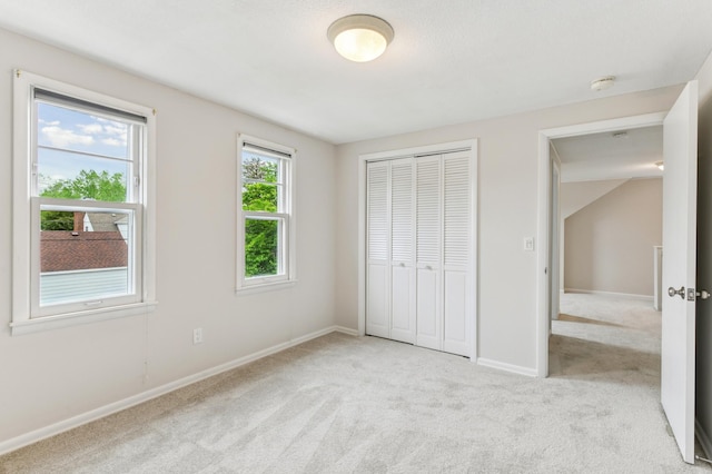 5824 10th Ave S, Minneapolis, MN 55417 - unfurnished bedroom with light carpet, a closet, and baseboards