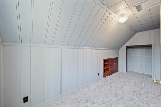 1610 Hennepin Ave N, Glencoe, MN 55336 - additional living space featuring lofted ceiling, carpet floors, and a decorative wall