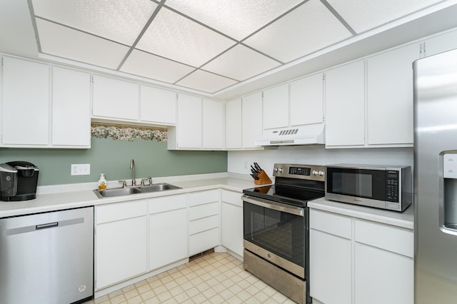2053 Carriage Dr SW Unit 2053E, Rochester, MN 55902 - kitchen with appliances with stainless steel finishes, under cabinet range hood, a sink, light countertops, and white cabinets