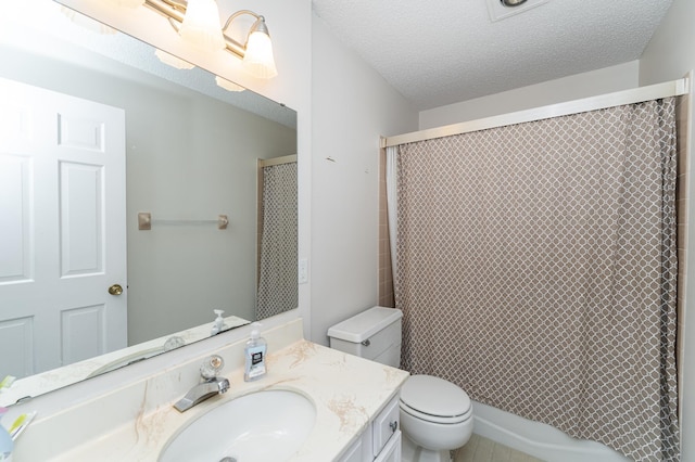 2053 Carriage Dr SW Unit 2053E, Rochester, MN 55902 - full bath featuring toilet, a textured ceiling, and vanity