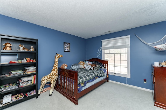 2053 Carriage Dr SW Unit 2053E, Rochester, MN 55902 - bedroom featuring carpet flooring, a textured ceiling, and baseboards