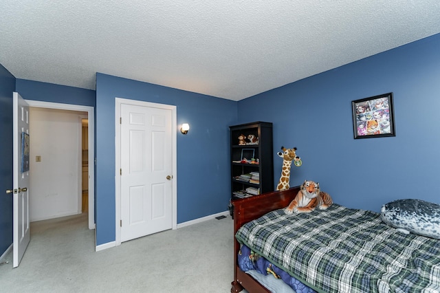 2053 Carriage Dr SW Unit 2053E, Rochester, MN 55902 - bedroom featuring carpet, baseboards, and a textured ceiling