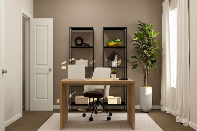 carpeted office space with plenty of natural light and baseboards