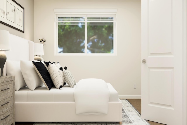 bedroom featuring baseboards