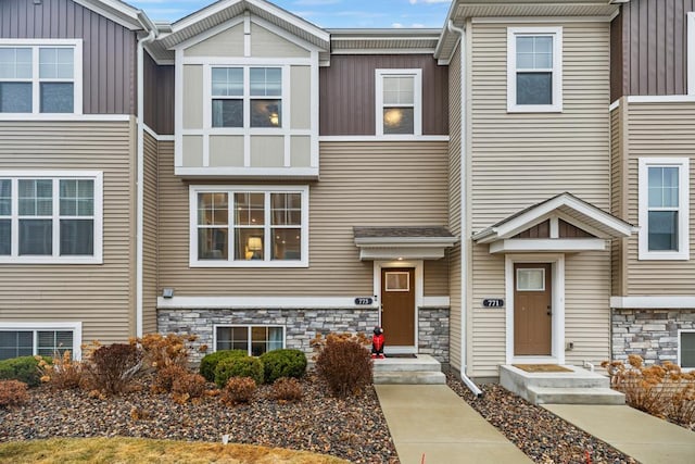 view of property featuring stone siding