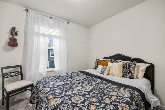 carpeted bedroom with a textured ceiling