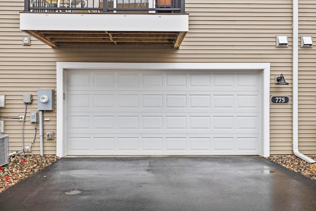 garage featuring aphalt driveway