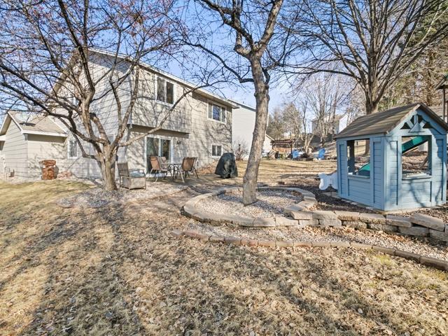 view of yard featuring a patio and an outdoor structure