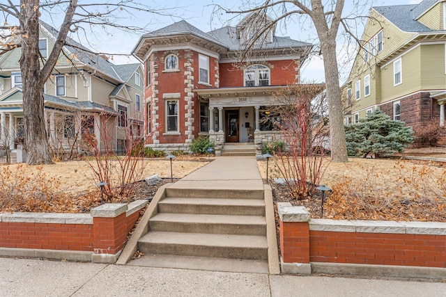 italianate-style house with brick siding