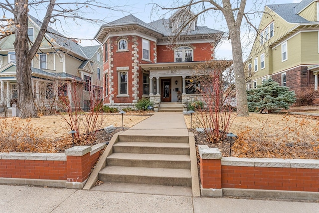 italianate-style house featuring brick siding