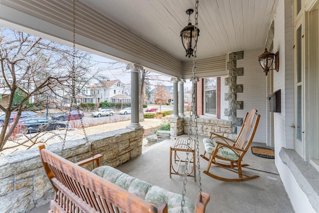 view of patio / terrace with covered porch and a residential view