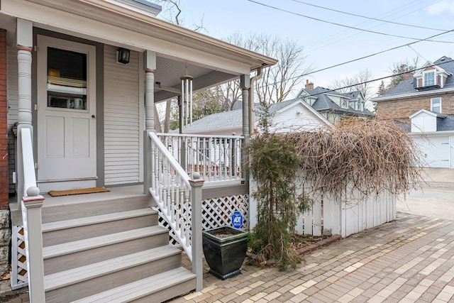 property entrance with covered porch