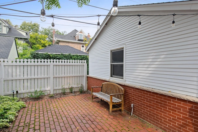 view of patio / terrace featuring fence