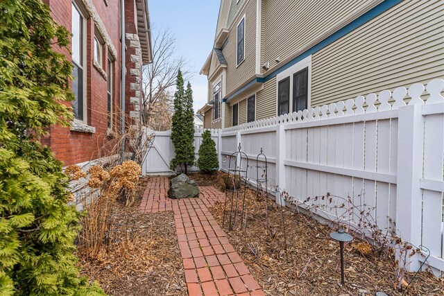 view of property exterior featuring fence