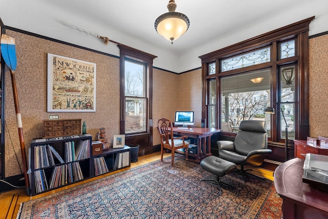 office featuring wallpapered walls and wood finished floors