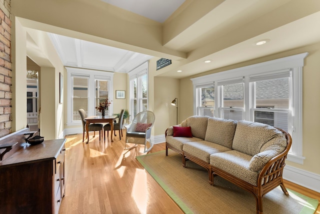 living room featuring baseboards, light wood-style floors, and recessed lighting