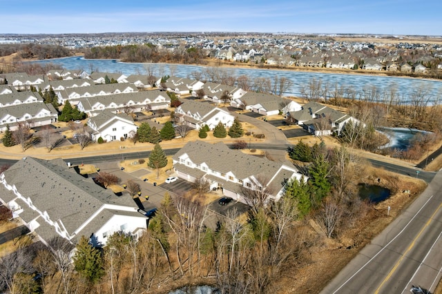 aerial view with a residential view and a water view