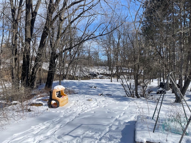 view of yard layered in snow