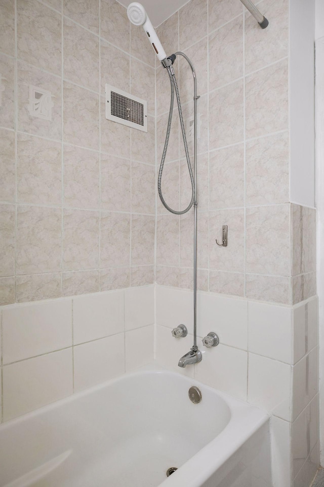 full bath with tub / shower combination and visible vents