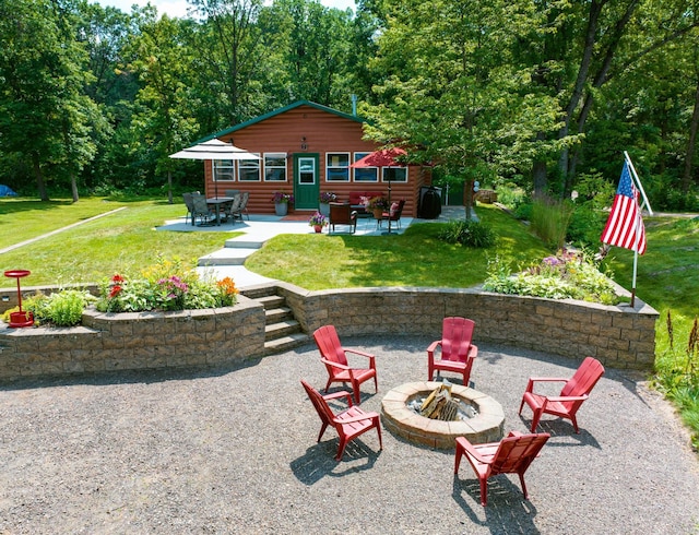 view of patio / terrace featuring an outdoor fire pit