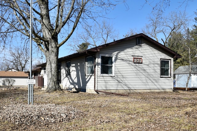 view of home's exterior featuring crawl space