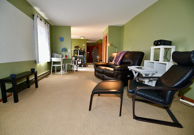 living area with baseboards and carpet