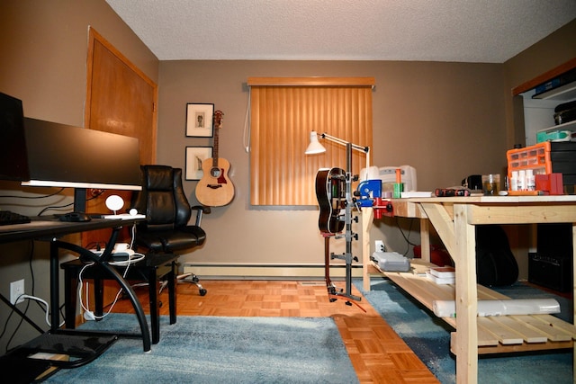 office area featuring a baseboard heating unit and a textured ceiling