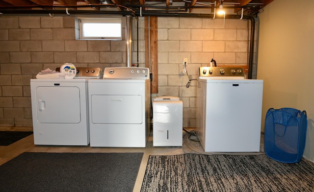 washroom featuring laundry area and washer and clothes dryer