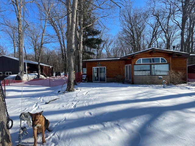 view of front of property with log veneer siding