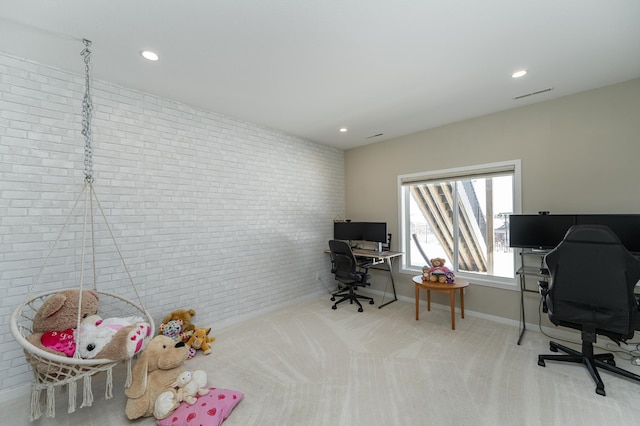 office featuring carpet floors, recessed lighting, visible vents, brick wall, and baseboards