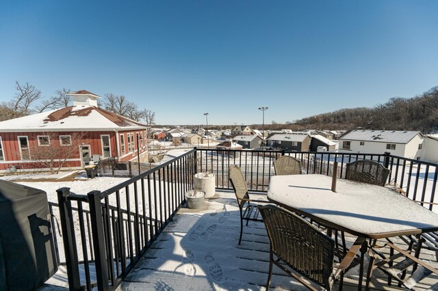 balcony featuring a residential view and outdoor dining space