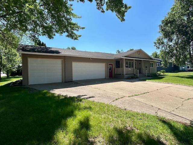1006 10th St SW, Wadena, MN 56482 - single story home with a porch, concrete driveway, an attached garage, and a front lawn