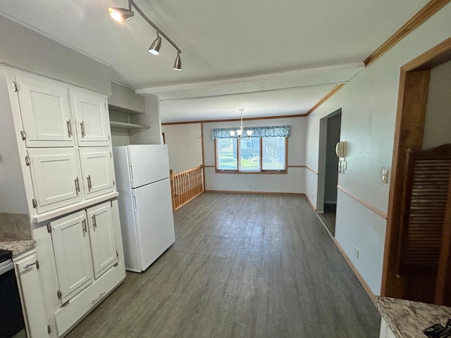 1006 10th St SW, Wadena, MN 56482 - kitchen with freestanding refrigerator, white cabinets, a chandelier, wood finished floors, and open shelves