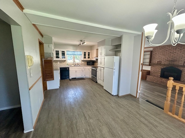 1006 10th St SW, Wadena, MN 56482 - kitchen featuring black appliances, dark wood-type flooring, white cabinets, and glass insert cabinets