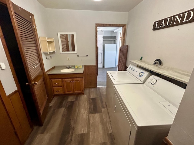 1006 10th St SW, Wadena, MN 56482 - laundry room with separate washer and dryer and dark wood finished floors