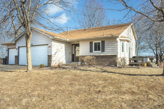 ranch-style house with driveway, a shingled roof, a front lawn, a garage, and brick siding