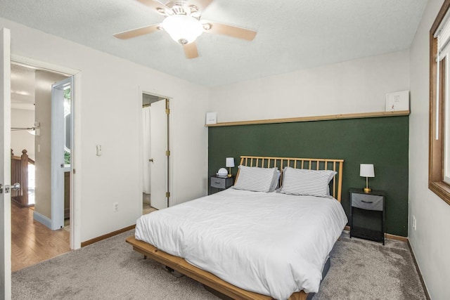 bedroom featuring ceiling fan, baseboards, and carpet floors