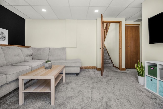 living room with stairway, carpet, baseboards, recessed lighting, and a drop ceiling