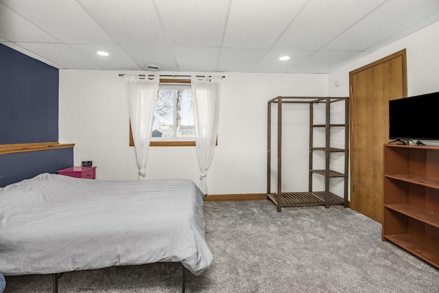 bedroom featuring carpet flooring, a paneled ceiling, and recessed lighting