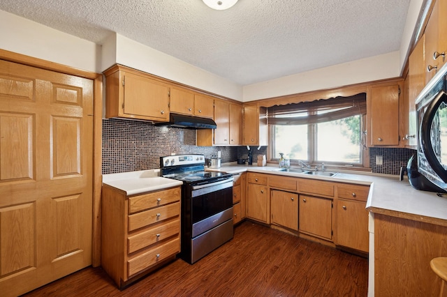 kitchen featuring dark wood-style floors, light countertops, stainless steel electric range, and under cabinet range hood