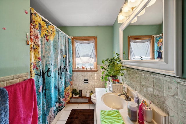 full bathroom featuring tile walls, toilet, vanity, a shower with curtain, and tile patterned floors