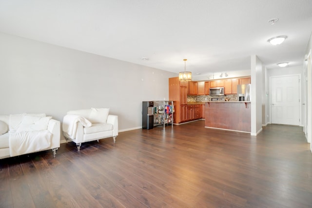 living room featuring dark wood finished floors and baseboards