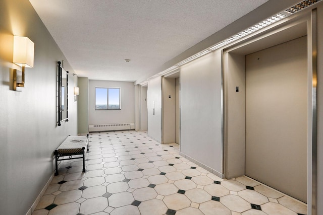 hallway with a baseboard heating unit, elevator, and a textured ceiling