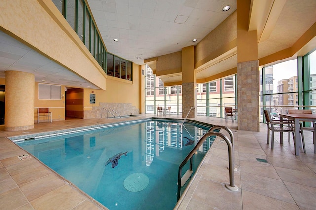 community pool with a patio and a sink