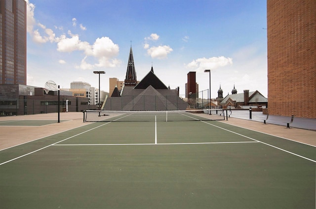 view of sport court with community basketball court and fence