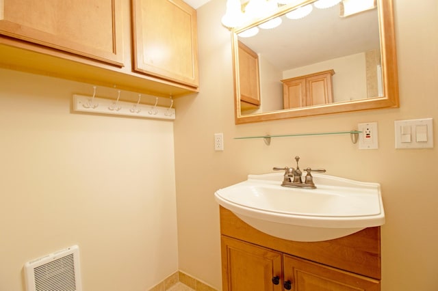 bathroom featuring vanity and heating unit