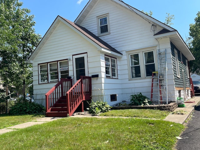 bungalow with a front yard