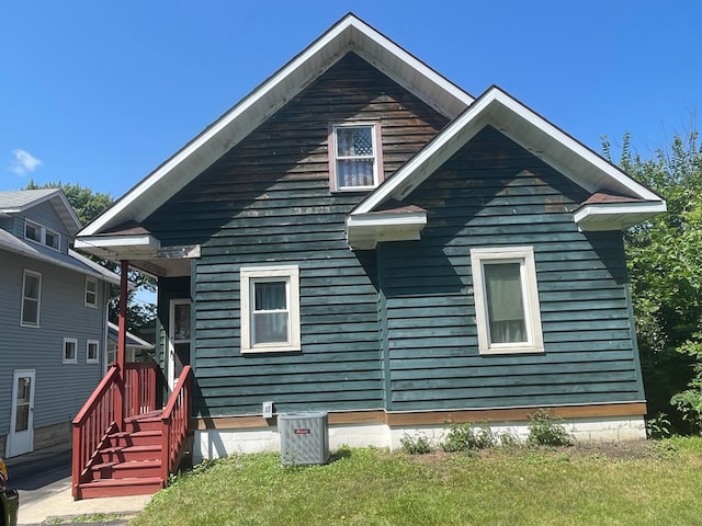 back of house featuring central AC unit