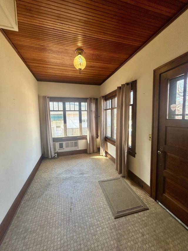 unfurnished sunroom featuring wood ceiling