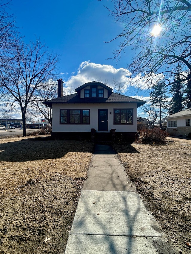 view of front of house with a chimney